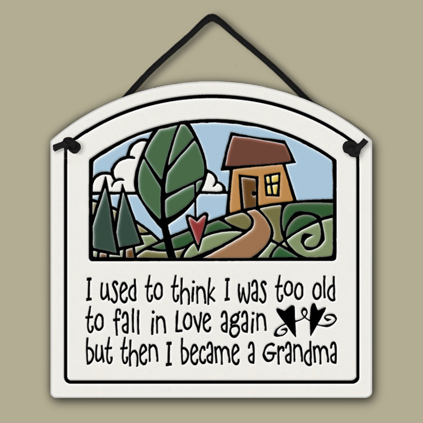 Ceramic wall tile with a cottage illustration and the quote ‘I used to think I was too old to fall in love again but then I became a Grandma.’