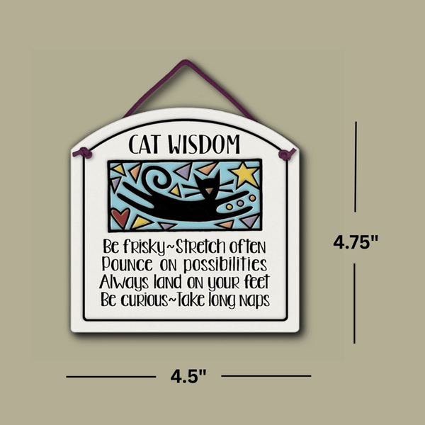 Ceramic wall tile featuring a playful cat illustration and the quote ‘Cat Wisdom: Be frisky, stretch often, pounce on possibilities…,’ shown with dimensions 4.75 inches tall and 4.5 inches wide.