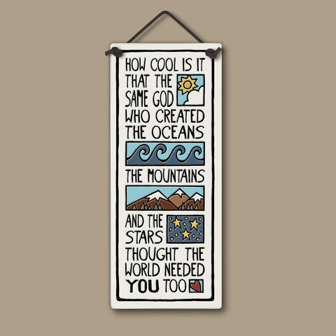 Handcrafted Spooner Creek tall ceramic tile with the quote “How cool is it that the same God who created the oceans, the mountains, and the stars thought the world needed you too,” featuring waves, mountains, stars, and sunrise illustrations, 3.5x8.5 inch inspirational wall art.