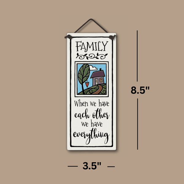 handcrafted tall ceramic tile with family quote and colorful home illustration, showing the dimensions.