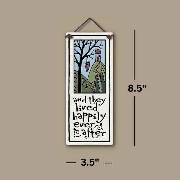 Spooner Creek large tall ceramic tile with dimensions 3.5 x 8.5 inches, featuring the quote “and they lived happily ever after,” shown on a neutral background with measurement lines; handmade wall art with whimsical cottage and heart illustration.