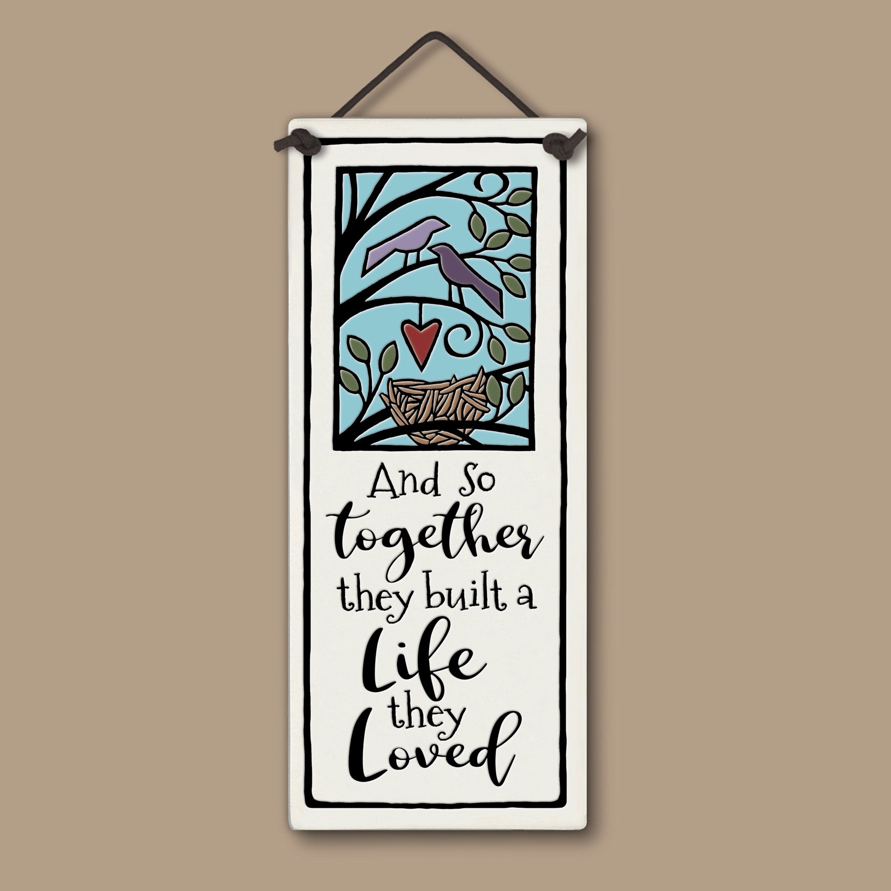 Spooner Creek large tall ceramic tile with two birds, a heart, and a nest illustration, featuring the quote “And so together they built a life they loved,” 3.5x8.5 inch hanging wall art, handmade in the USA.