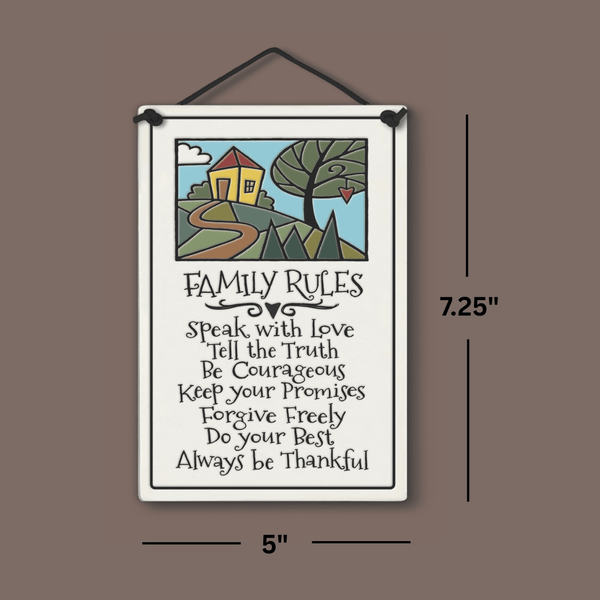Spooner Creek large rectangle ceramic tile wall hanging with quote “Family Rules: Speak with love… Always be thankful,” cheerful house and tree artwork, black hand lettering, dimensions shown 5 x 7.25 inches.
