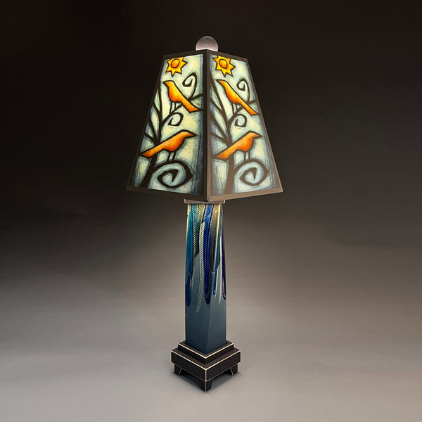 Birds in Tree handmade ceramic table lamp with twisted blue extruded clay base, glowing bird and tree art shade by Michael Macone, made in Shell Lake Wisconsin