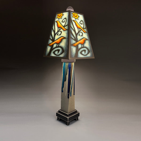 Birds in Tree handmade ceramic table lamp with twisted gray extruded clay base, illuminated orange birds and yellow sun shade by Michael Macone, made in Shell Lake Wisconsin