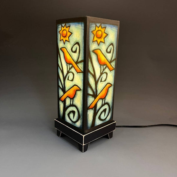 Birds in Tree mood lamp lit and glowing on gray background