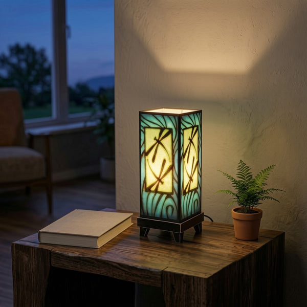 Blue Dragonfly mood lamp glowing on a living room table