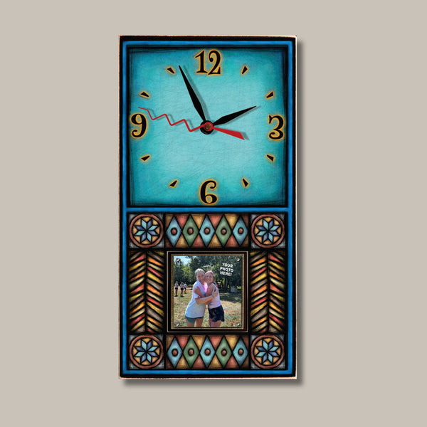 Blue Motif geometric picture frame wood wall clock by Michael Macone with a turquoise face, a bright blue border, and a 2 x 2 photo held by magnets in a terracotta, gold, and turquoise mosaic panel