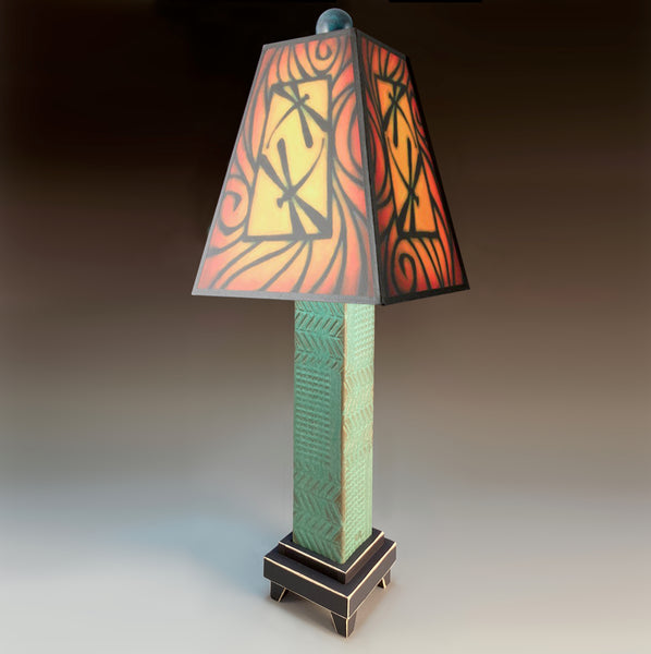 Brown Dragonfly handmade ceramic table lamp with green stoneware base, glowing warm dragonfly art shade in reds and gold by Michael Macone, made in Shell Lake Wisconsin