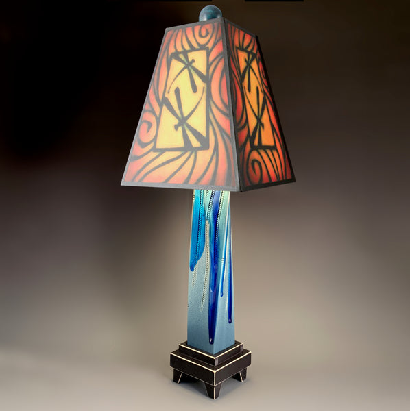 Brown Dragonfly handmade ceramic table lamp with twisted blue extruded clay base, bold warm dragonfly art shade in reds and gold by Michael Macone, made in Shell Lake Wisconsin
