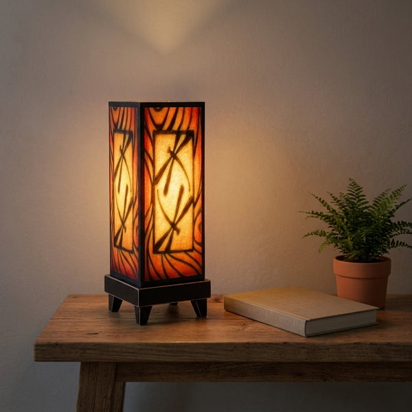 Brown Dragonfly mood lamp glowing on a living room console table