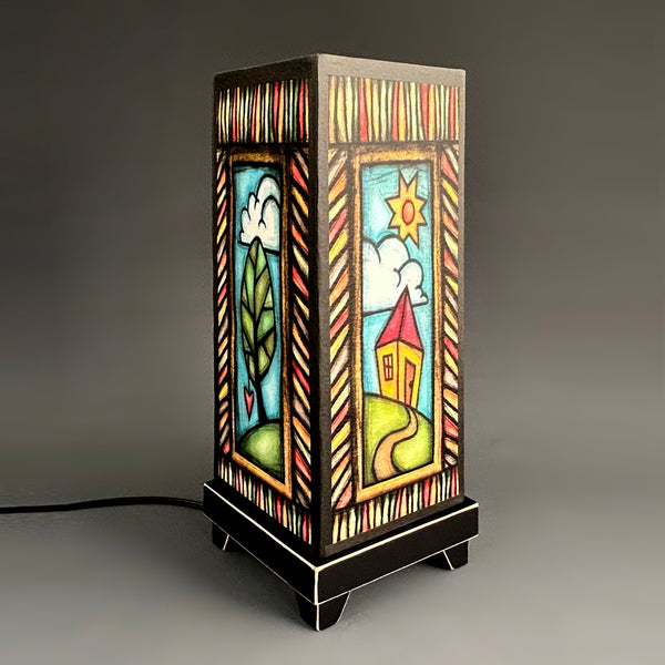 Day Sky mood lamp glowing with whimsical folk-art paper shade
