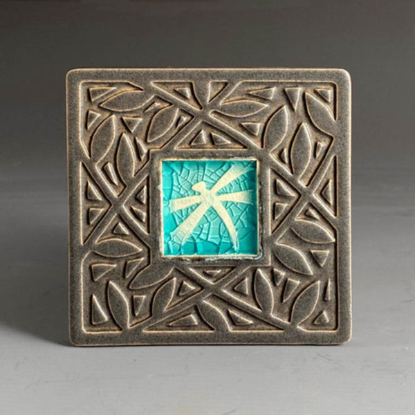 Handmade ceramic dragonfly coaster with crazed glass center and carved leaf border in turquoise and bronze by Macone Clay