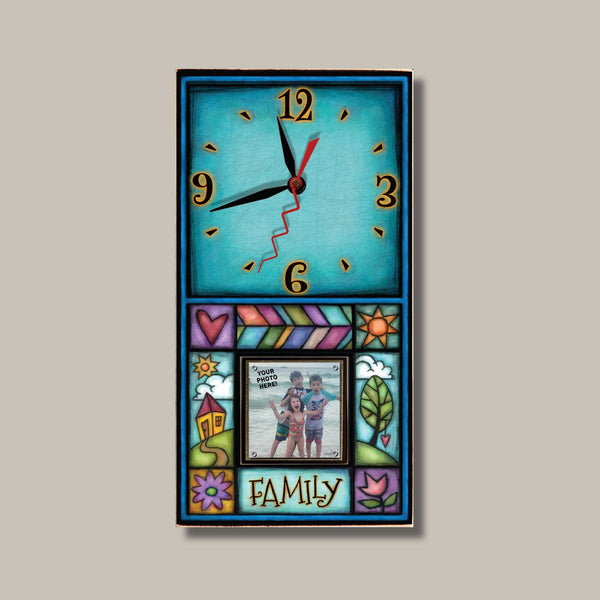 Family photo picture frame wood wall clock by Michael Macone with the quote Family, a turquoise face, and a 2 x 2 photo held by magnets in a colorful house and tree panel