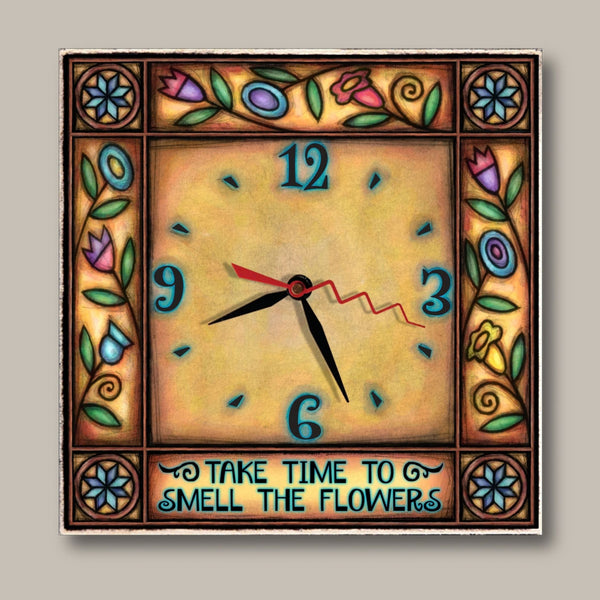 Floral square wood wall clock by Michael Macone with the quote Take Time to Smell the Flowers, a golden face, and colorful tulips and vines around the border