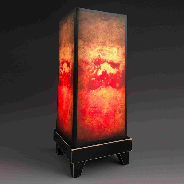 Florence mood lamp glowing with abstract fresco-inspired paper shade