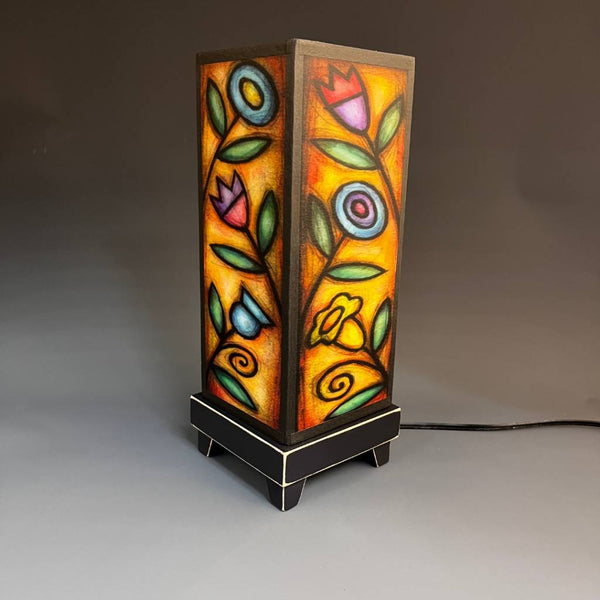 Flowers mood lamp lit in a bright, naturally lit room
