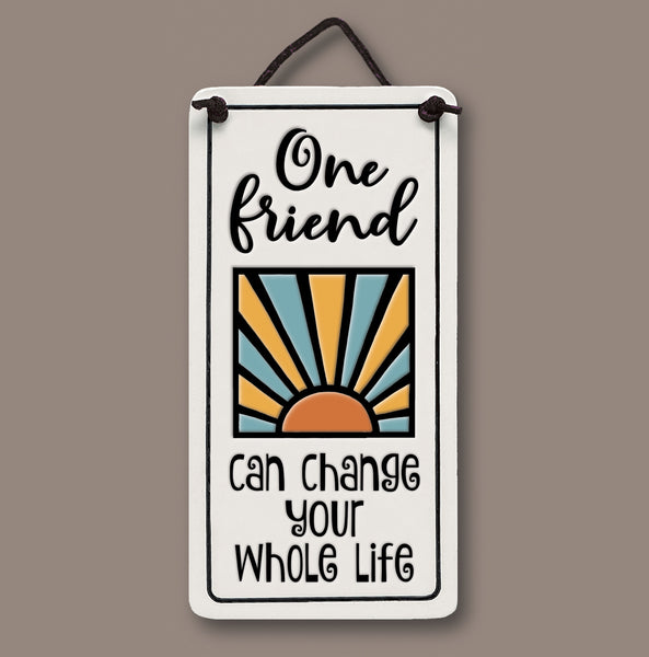 Handmade Spooner Creek Mini Charmer ceramic tile with quote “One friend can change your whole life,” featuring a sunrise design and hanging cord
