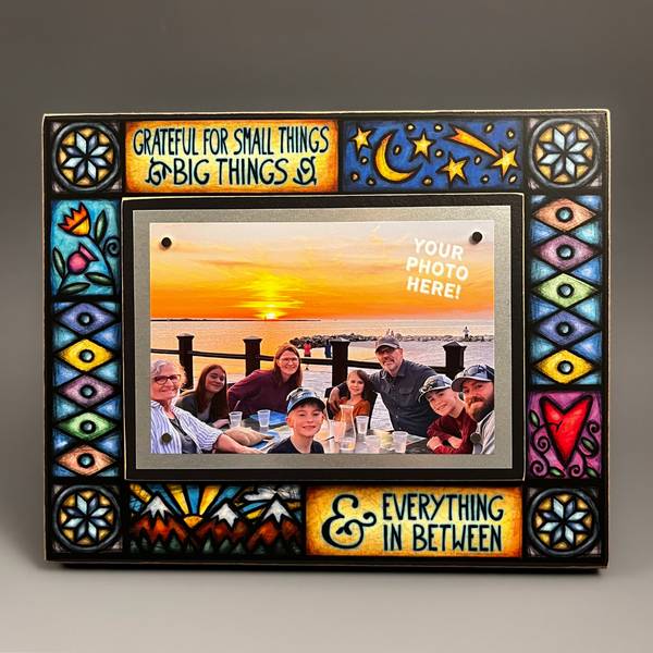 Colorful stained glass style picture frame with grateful for small things big things and everything in between quote holding sunset family photo