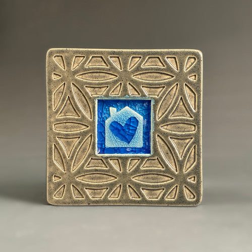 Handmade gray ceramic house with heart coaster with crazed glass center and carved geometric border by Macone Clay.