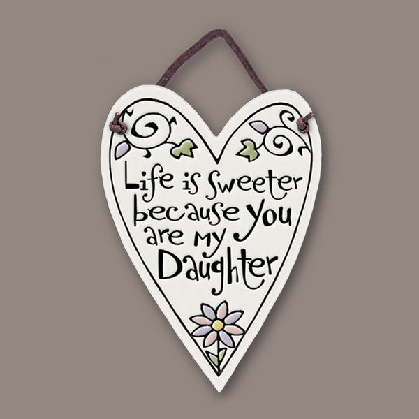 Heart shaped ceramic mini charmer with the quote “Life is sweeter because you are my daughter,” a handmade Spooner Creek keepsake gift ready for hanging.
