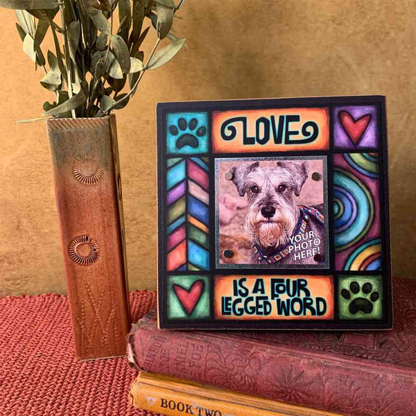 Dog lover picture frame on shelf with Love is a four legged word quote and colorful artwork, small 2x2 photo frame gift for pet lovers