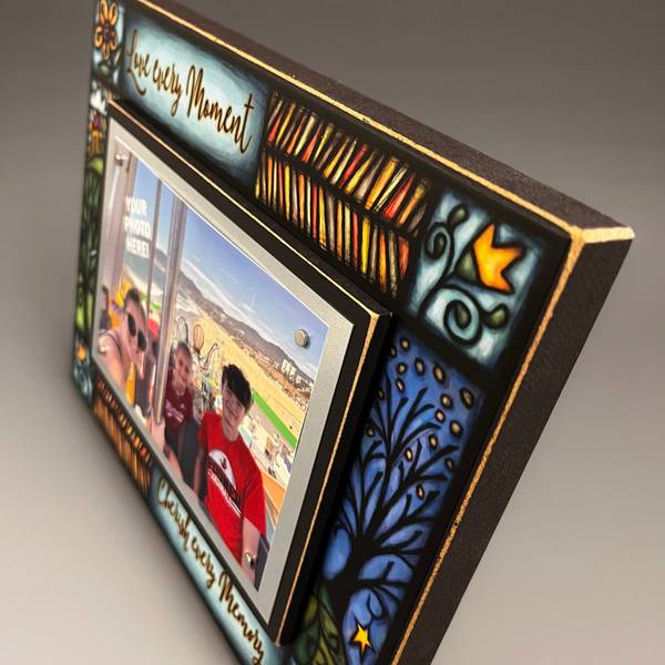 Top corner detail of Macone Clay Love Every Moment picture frame featuring colorful Michael Macone artwork and wood frame edge craftsmanship