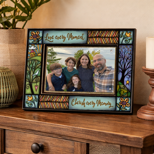 Macone Clay Love Every Moment 4x6 picture frame displayed on wood console table, colorful inspirational Michael Macone art home decor