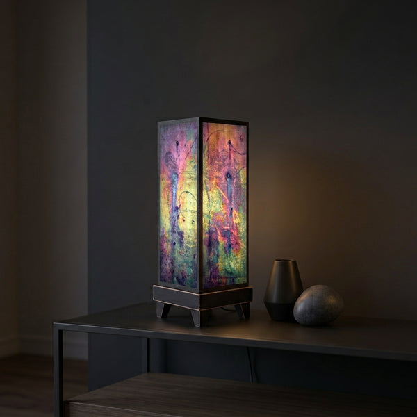 Metallic Glass mood lamp glowing on a modern living room console
