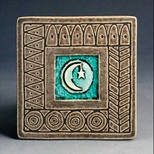 Handmade gray ceramic moon and star coaster with crazed glass center and carved geometric border by Macone Clay