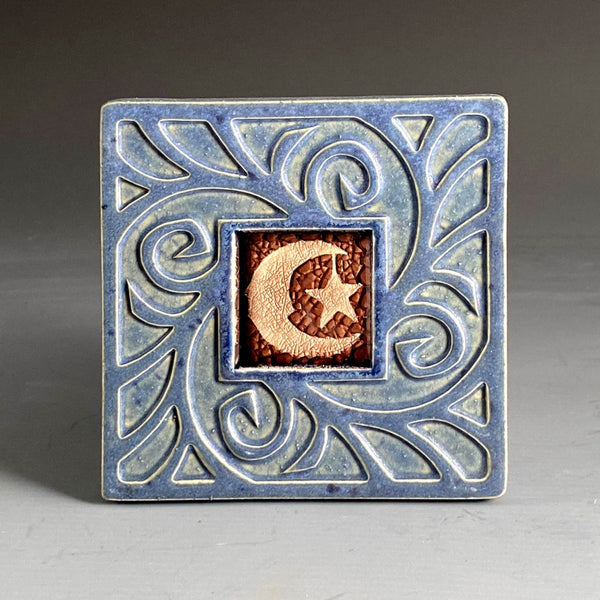 Handmade blue gray ceramic moon and star coaster with crazed glass center and carved swirl border by Macone Clay