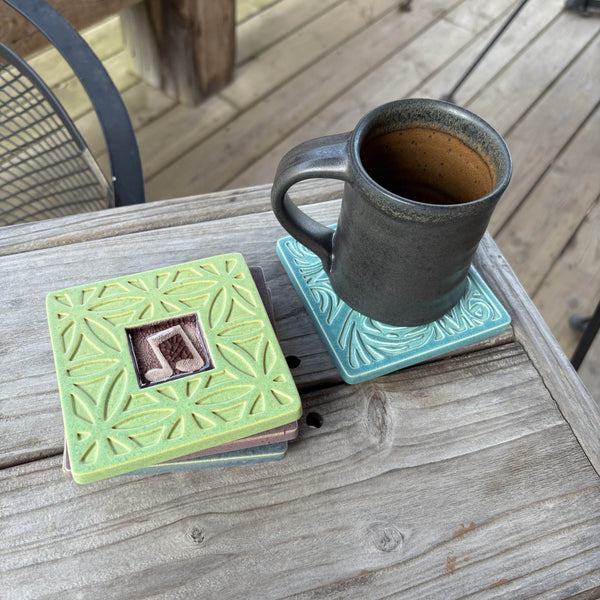  Handmade green ceramic music note coaster with crazed glass center styled with a mug on a matching ceramic coaster by Macone Clay