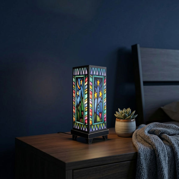 Night Sky mood lamp glowing on a bedroom nightstand