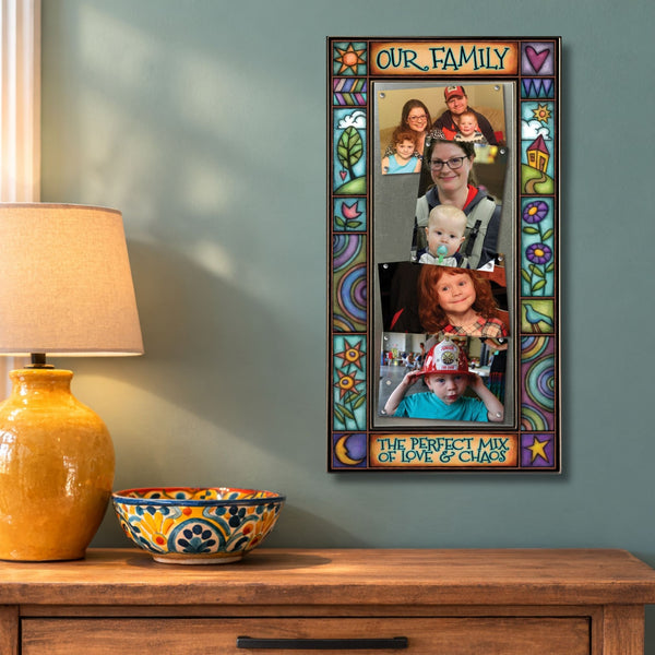 Large multi photo family frame wall display featuring quote Our family the perfect mix of chaos and love with colorful Michael Macone artwork.