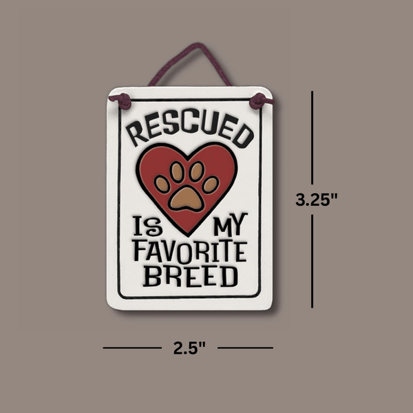 Dimension view of Spooner Creek Mini Charmer ceramic tile with “Rescued is my favorite breed” quote, showing 2.25 x 3.5 inch size