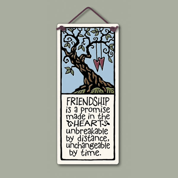 Spooner Creek small tall ceramic plaque with friendship quote “Friendship is a promise made in the heart,” featuring tree artwork and hanging hearts