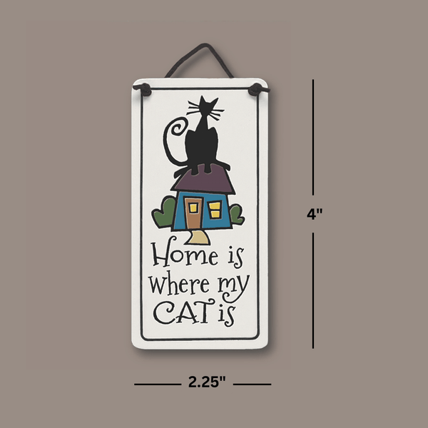 Dimensions of Spooner Creek Mini Charmer ceramic tile reading “Home is where my cat is,” measuring approximately 2 by 4 inches.