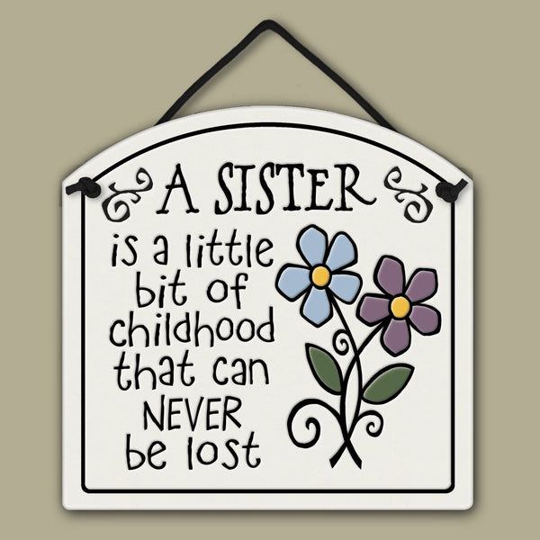 Spooner Creek small arch ceramic tile with sister quote, A sister is a little bit of childhood that can never be lost, featuring floral artwork and handmade Wisconsin craftsmanship
