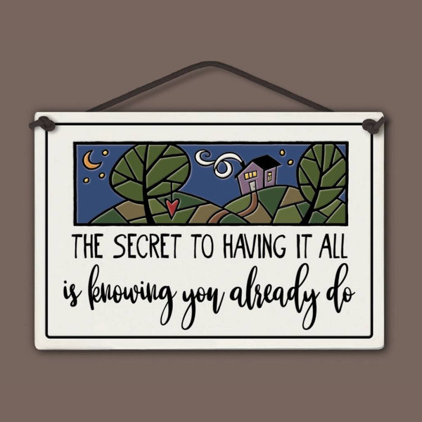 Spooner Creek large rectangle ceramic tile wall hanging with quote “The secret to having it all is knowing you already do,” whimsical night sky, house, and trees artwork, black lettering, 5 x 7.25 inspirational decor sign.