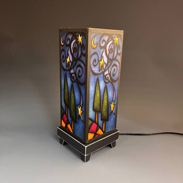 Starry Night mood lamp glowing with whimsical golden night sky paper shade