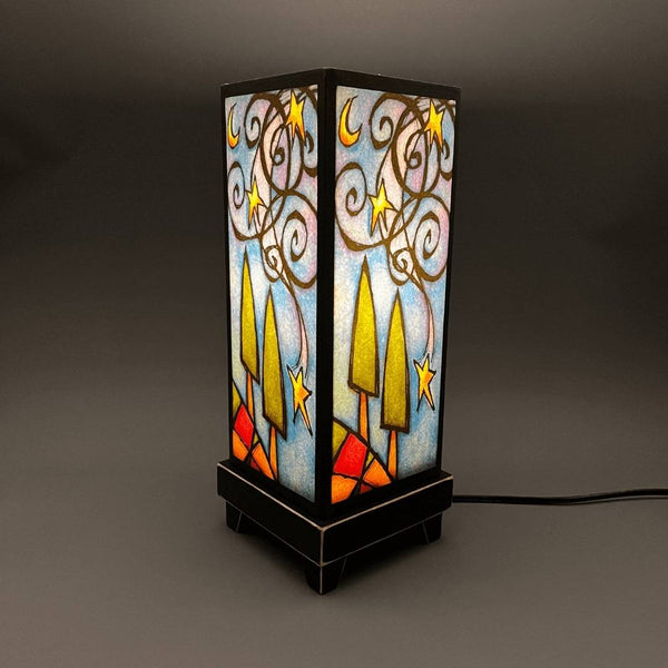 Starry Night mood lamp lit with room lights off, showing purple and blue tones