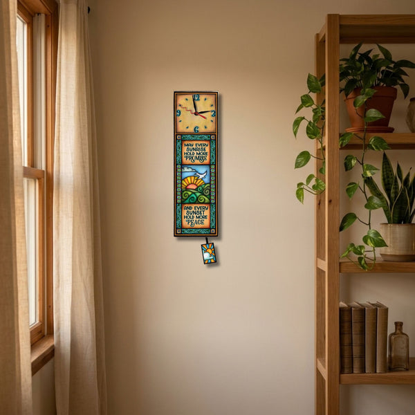 Sunrise Sunset wood wall clock hanging on a kitchen wall above the counter