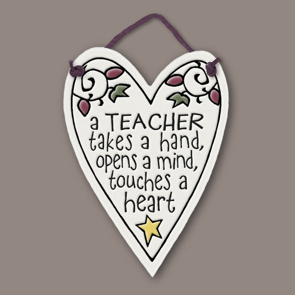 Heart shaped Spooner Creek Mini Charmer ceramic tile with teacher quote “A teacher takes a hand, opens a mind, touches a heart,” handmade in Wisconsin.