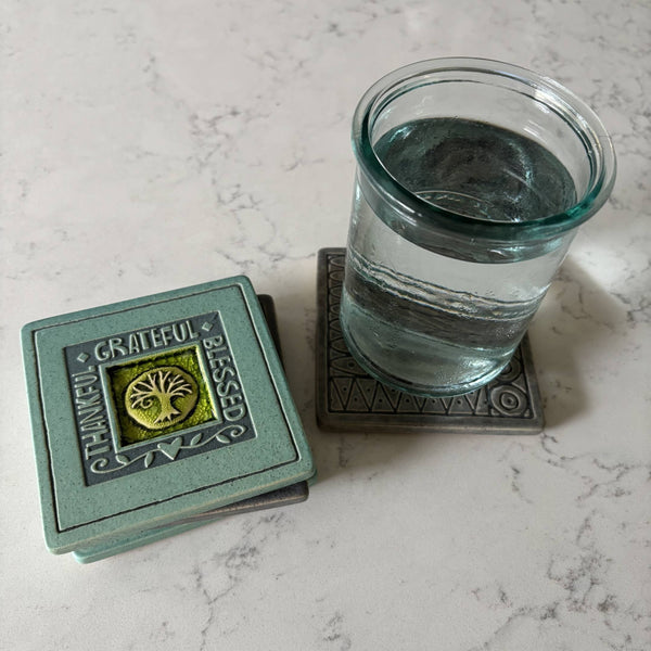 Handmade turquoise ceramic Thankful Grateful Blessed tree coaster with crazed glass center styled with a mug on a matching ceramic coaster by Macone Clay.