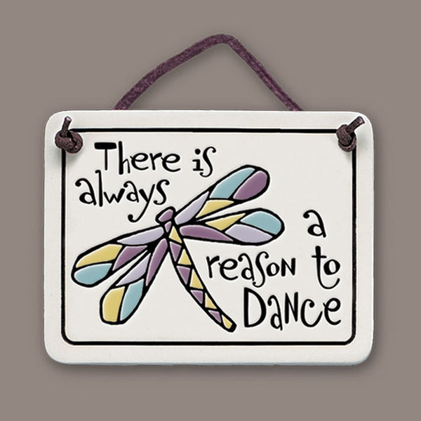 Handmade Spooner Creek Mini Charmer ceramic tile featuring the quote “There is always a reason to dance,” with colorful dragonfly artwork and leather like hanging cord.