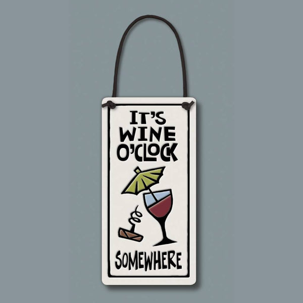 Glazed ceramic Spooner Creek wine tag reading It’s wine o’clock somewhere with wine glass artwork, leather like cord, handmade wine bottle gift made in USA