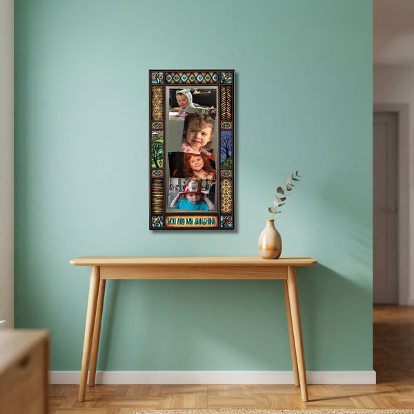 Family photo frame wall display featuring quote You are my sunshine with colorful Michael Macone artwork and four photo layout.