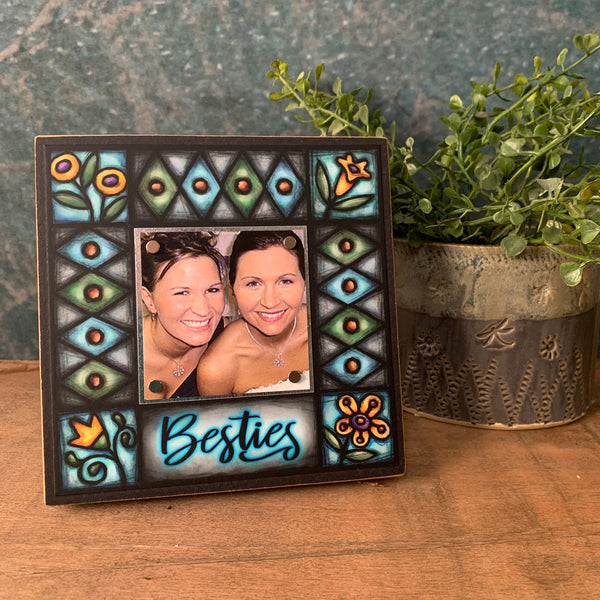 Besties best friend picture frame displayed on tabletop with Michael Macone artwork, small square wood frame with magnetic photo display, handmade in Shell Lake Wisconsin