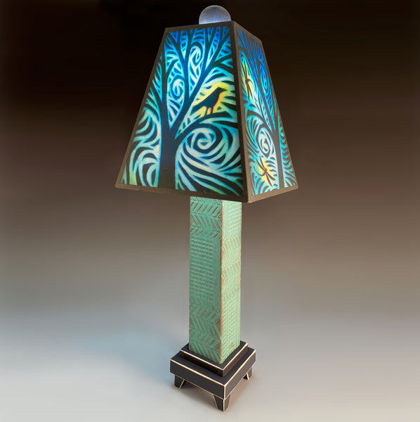 Bird and Dragonfly handmade ceramic table lamp with green stoneware base, glowing teal forest and wildlife shade by Michael Macone, made in Shell Lake Wisconsin