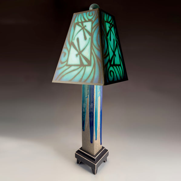 Blue Dragonfly handmade ceramic table lamp with gray glass finish base, illuminated blue and teal dragonfly shade by Michael Macone, made in Shell Lake Wisconsin